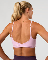 Woman wearing Twist Sports Bra - Marshmallow | Model:Emelia | Size:XS