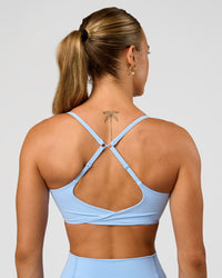 Woman wearing Twist Sports Bra - Open Air | Model:Maja | Size:XS