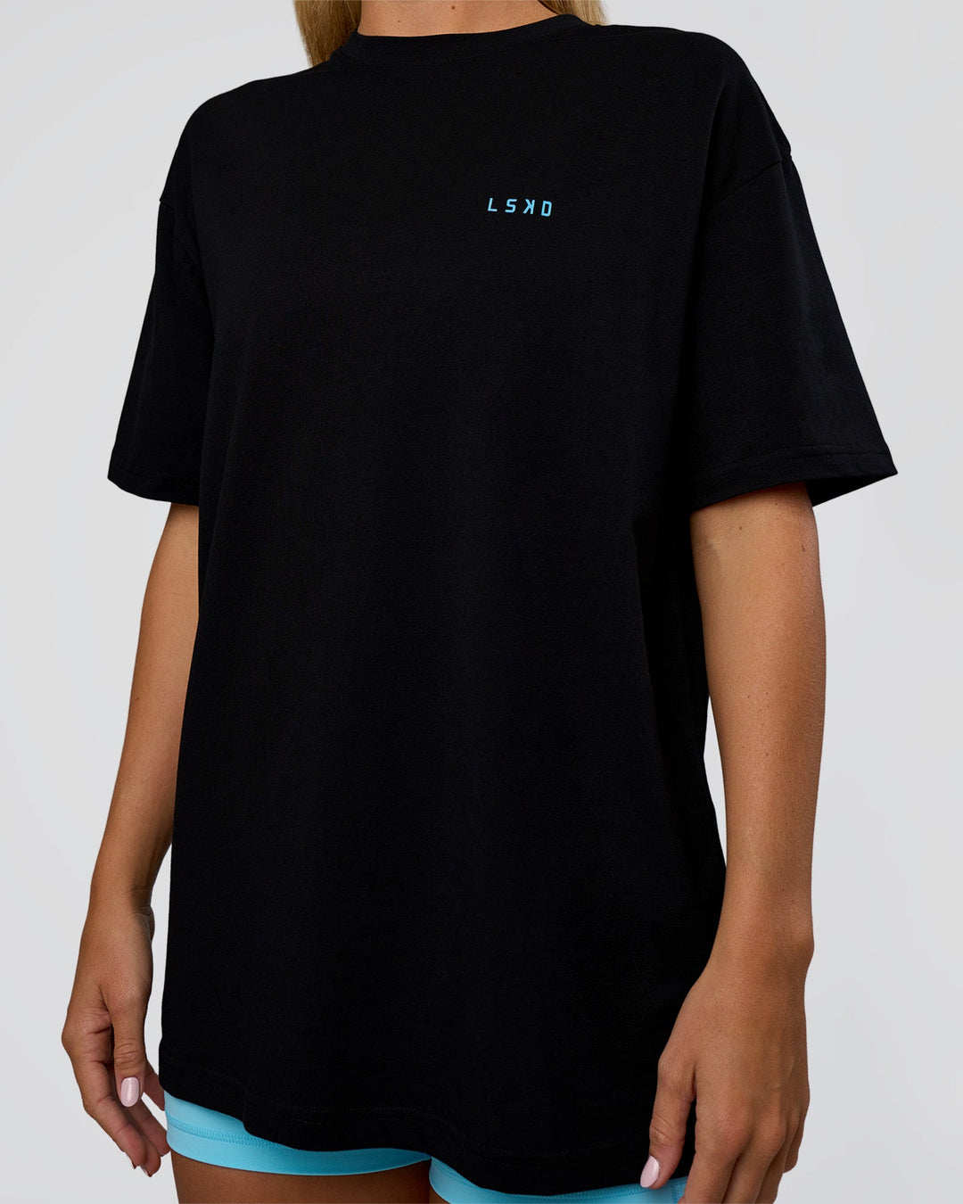 Woman wearing Unfit Club FLXCotton Oversized Tee - Black-White | Model:Amity | Size:XS