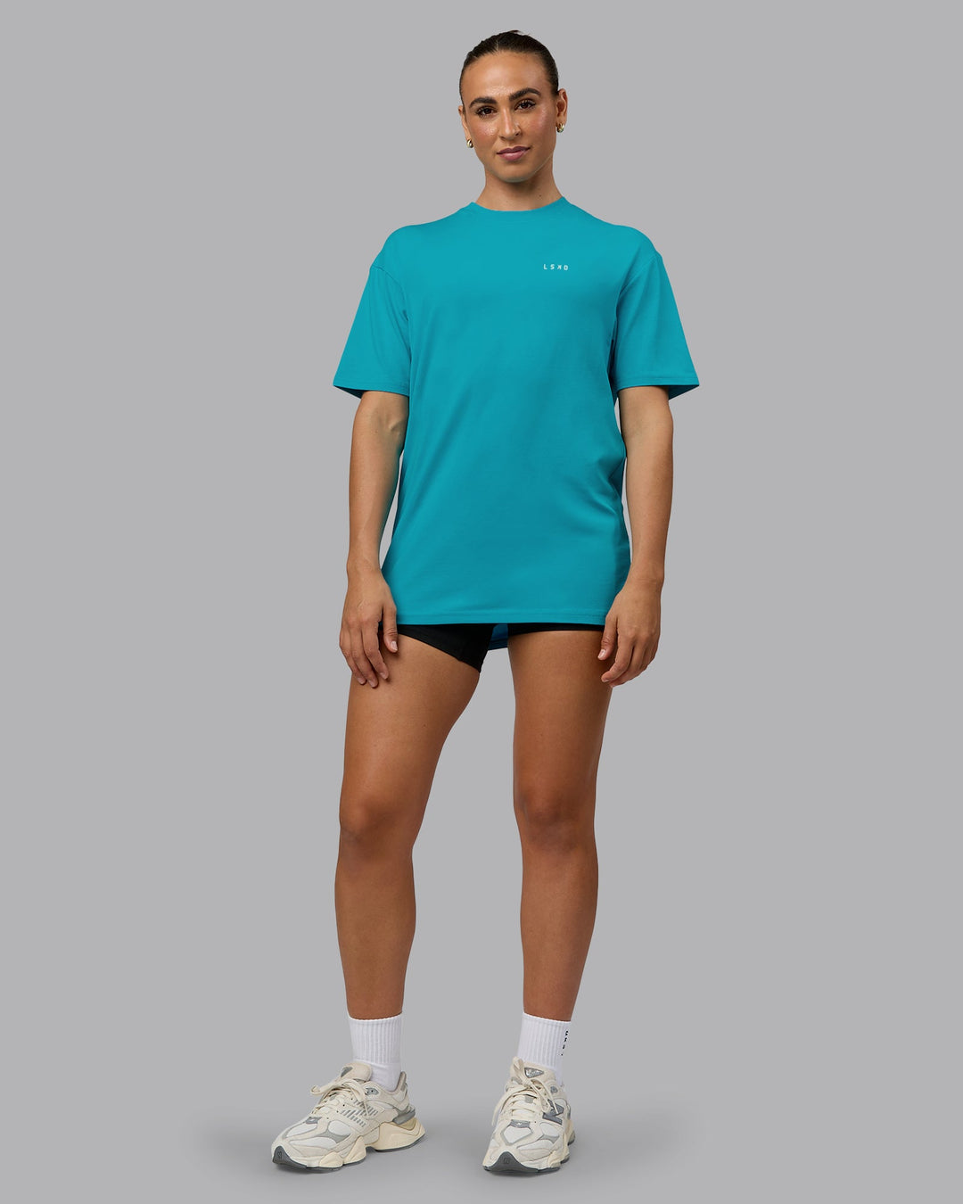 Woman wearing Unisex Enjoy the Journey Value Series FLXCotton Tee Oversize - Bluebird-Surf Spray