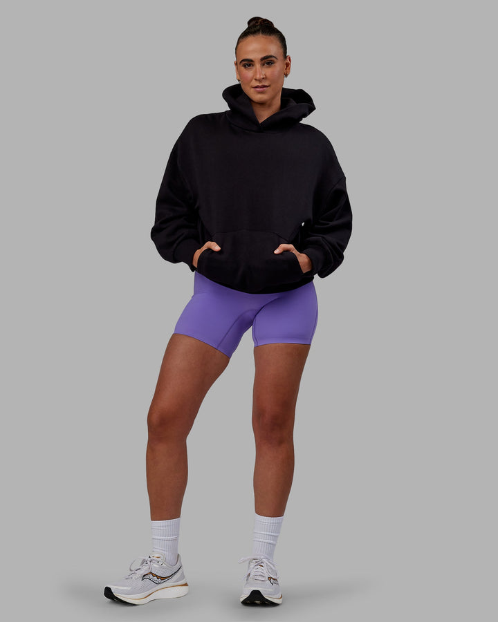 Woman wearing Unisex Keep on Running Hoodie Oversize - Black-White
