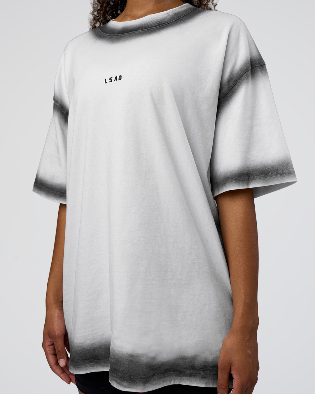 Woman wearing Urban Blur Heavyweight Unisex Oversized Tee - White-Black | Model:Jordan | Size:S