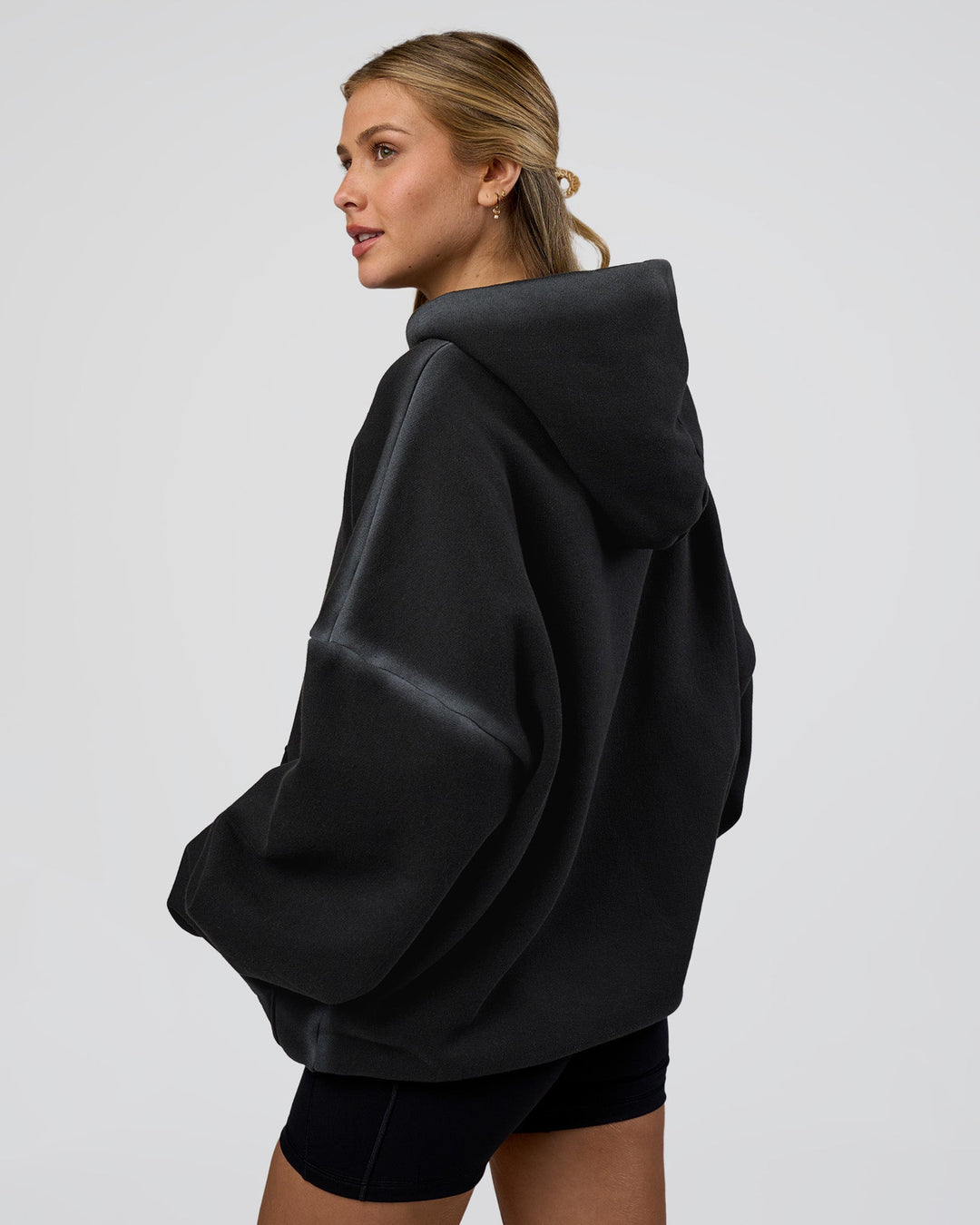 Woman wearing Urban Blur Unisex Oversized Hoodie - Black-Dark Storm | Model:Leilani | Size:XS