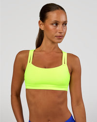 Woman wearing Velocity Sports Bra - Lime Glo | Model:Brylee | Size:XS