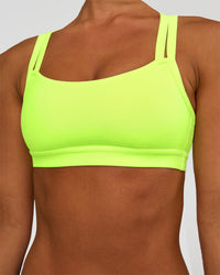 Woman wearing Velocity Sports Bra - Lime Glo | Model:Brylee | Size:XS