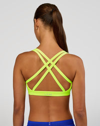 Woman wearing Velocity Sports Bra - Lime Glo | Model:Brylee | Size:XS