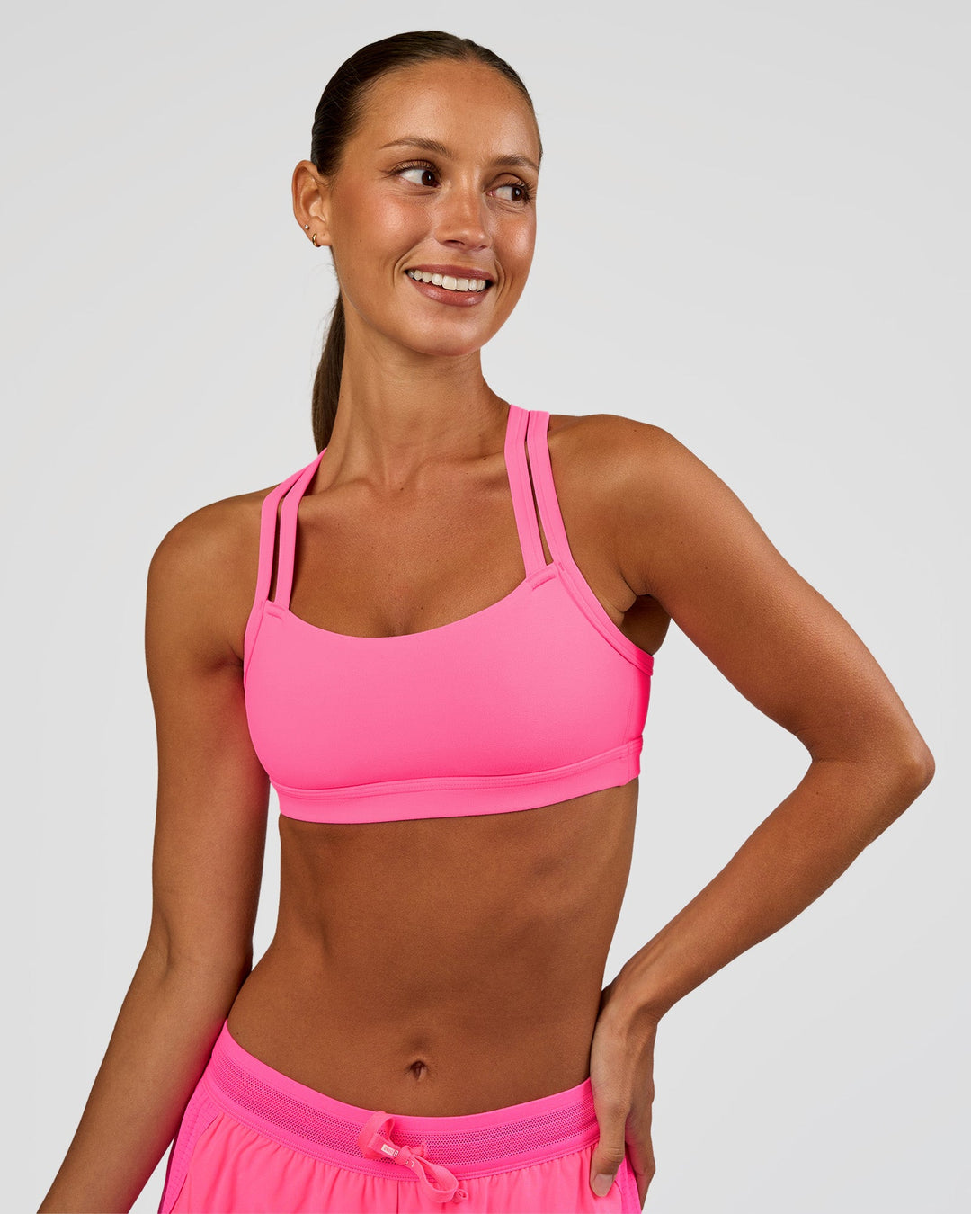 Woman wearing Velocity Sports Bra - Sugar Plum | Model:Brylee | Size:XS