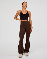 Woman wearing Vitality Long Line Sports Bra - Black | Model:Maja | Size:XS