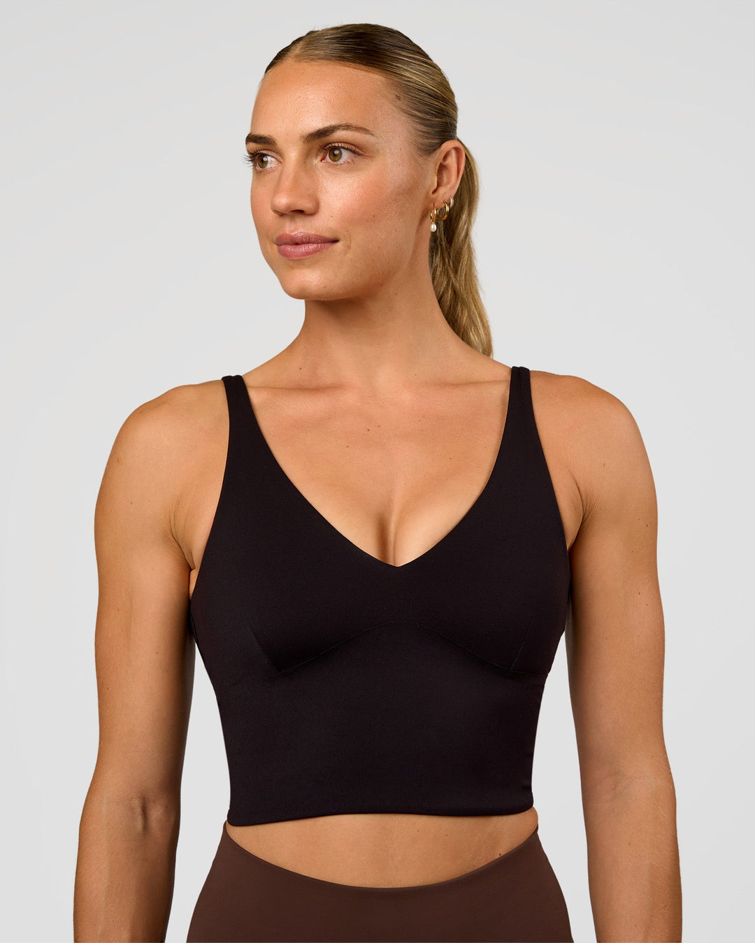 Woman wearing Vitality Long Line Sports Bra - Black | Model:Maja | Size:XS - view 1