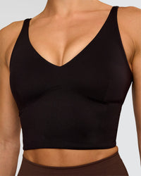 Woman wearing Vitality Long Line Sports Bra - Black | Model:Maja | Size:XS