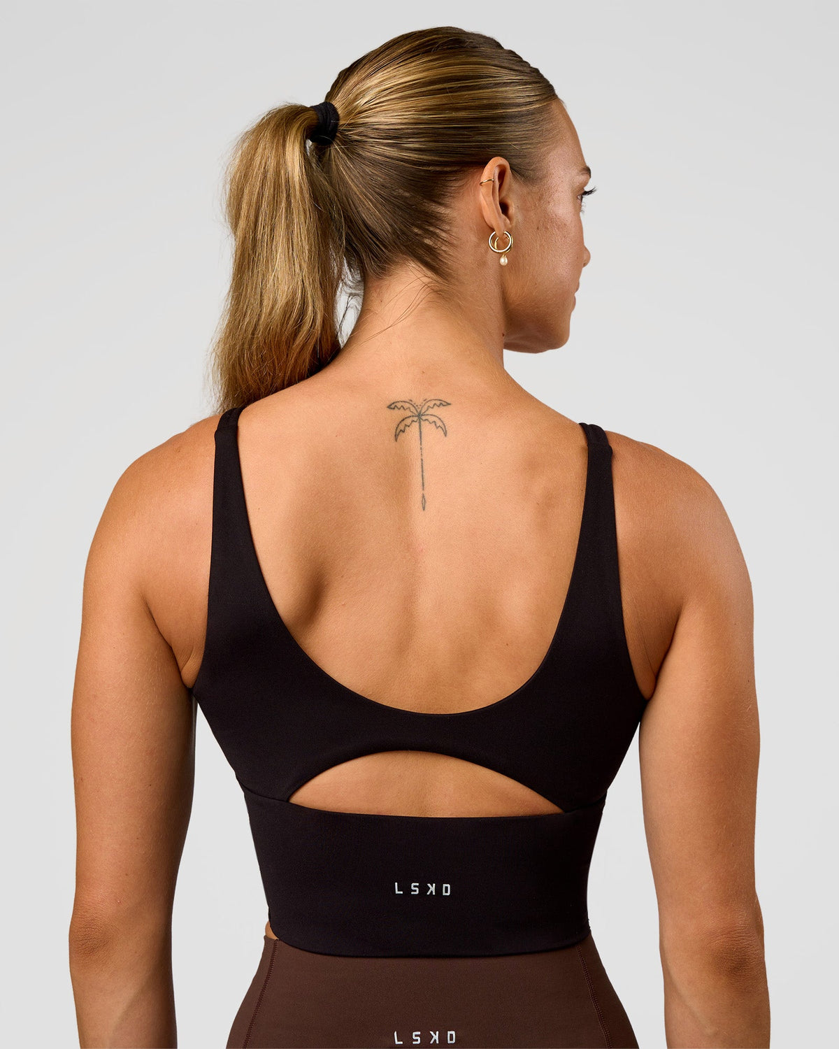 Woman wearing Vitality Long Line Sports Bra - Black | Model:Maja | Size:XS
