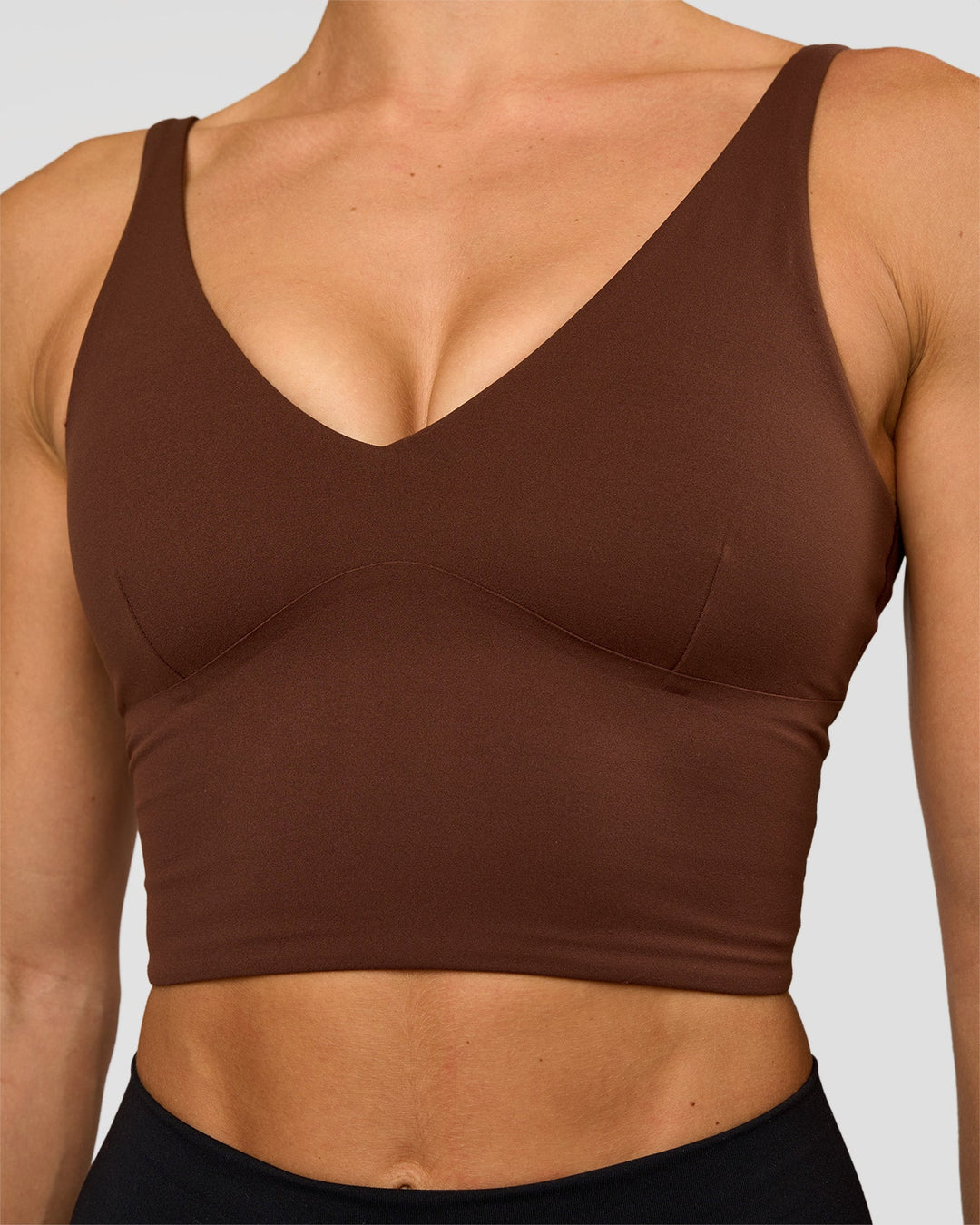 Woman wearing Vitality Long Line Sports Bra - Hot Chocolate | Model:Maja | Size:XS