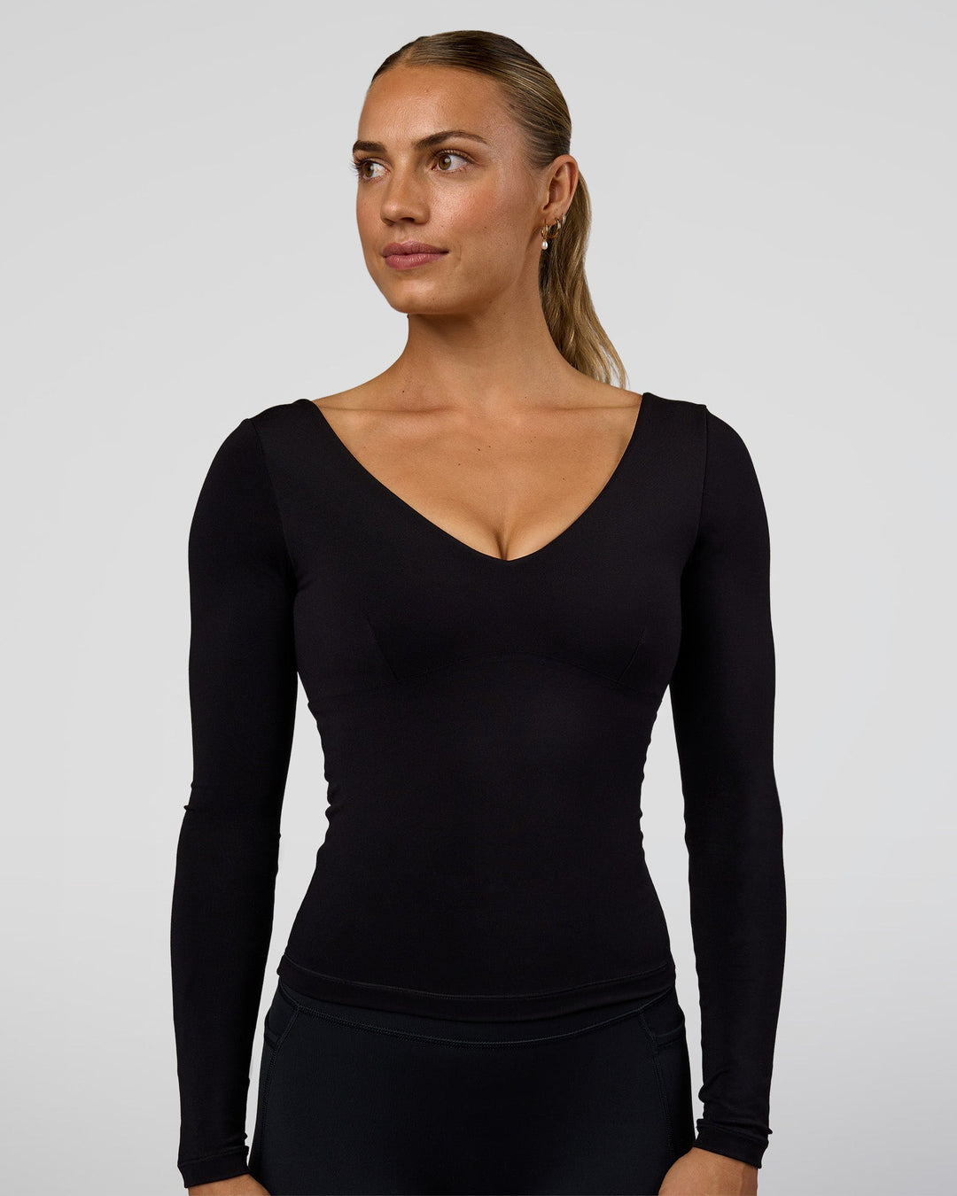 Woman wearing Vitality Long Sleeve Top - Black | Model:Maja | Size:XS