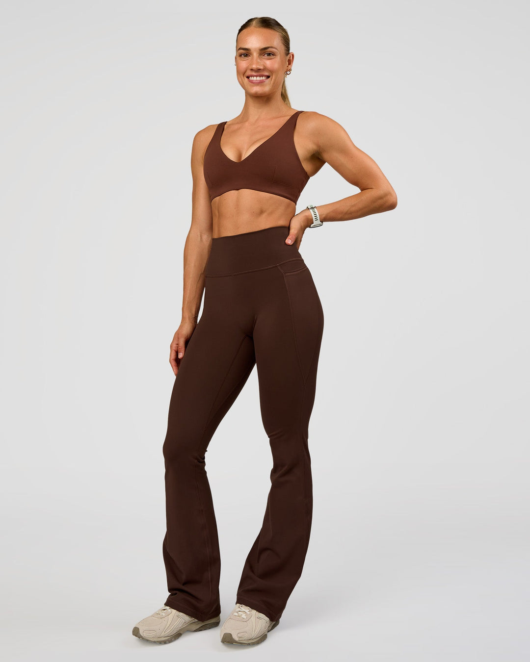 Woman wearing Vitality Sports Bra - Hot Chocolate | Model:Maja | Size:XS