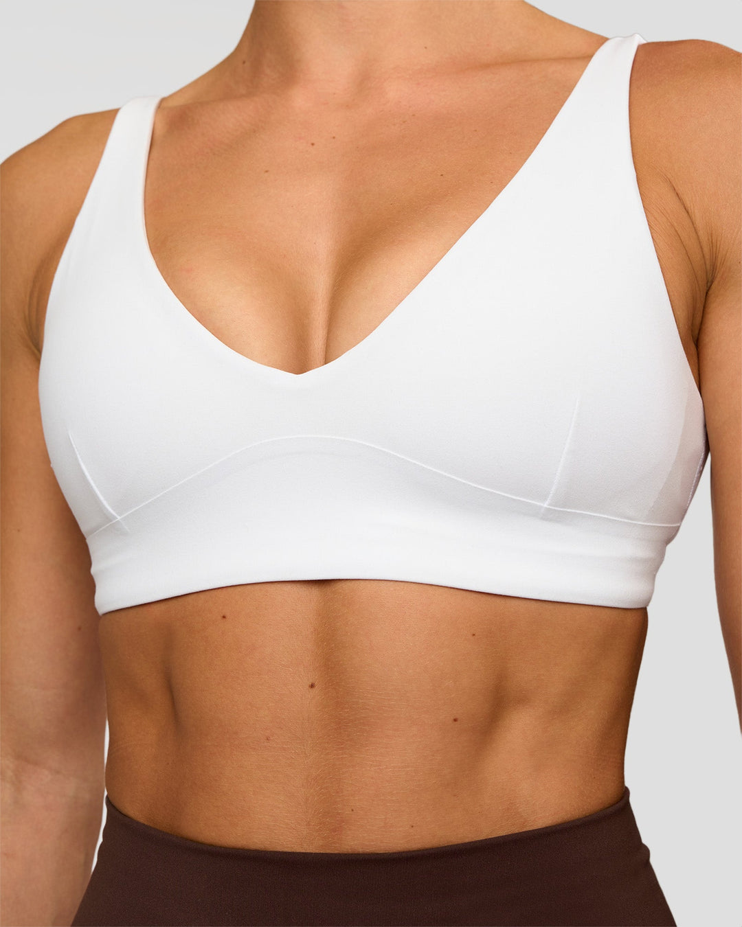 Woman wearing Vitality Sports Bra - White | Model:Maja | Size:XS