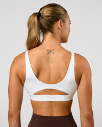 Woman wearing Vitality Sports Bra - White | Model:Maja | Size:XS