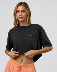 Woman wearing We Love This  FLXCotton Oversized Tee - Black Washed-White | Model:Leilani | Size:XS