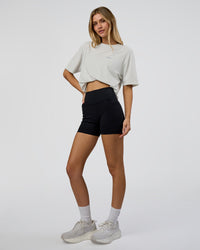 Woman wearing We Love This  FLXCotton Oversized Tee - Digital Mist Washed-Electric Indigo | Model:Leilani | Size:XS