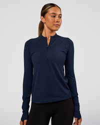 Woman wearing AeroFLX+ Long Sleeve Half Zip - Future Navy/Future Navy | Model:Charli | Size:XS | Thumbnail Index: 0