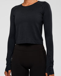 Woman wearing AeroFLX+ Seamless Long Sleeve Skimmer Tee - Black Marl | Model:Charli | Size:XS