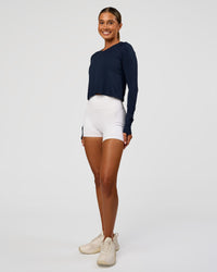 Woman wearing AeroFLX+ Seamless Long Sleeve Skimmer Tee - Future Navy/Future Navy | Model:Charli | Size:XS
