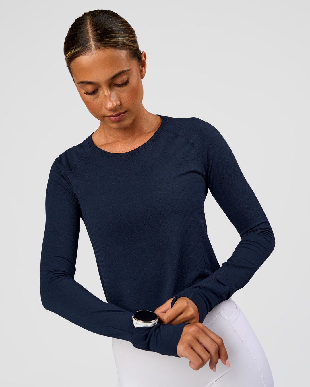 Woman wearing AeroFLX+ Seamless Long Sleeve Skimmer Tee - Future Navy/Future Navy | Model:Charli | Size:XS