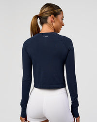 Woman wearing AeroFLX+ Seamless Long Sleeve Skimmer Tee - Future Navy/Future Navy | Model:Charli | Size:XS