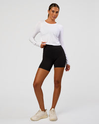 Woman wearing AeroFLX+ Seamless Long Sleeve Skimmer Tee - White/White | Model:Charli | Size:XS | Thumbnail Index: 5