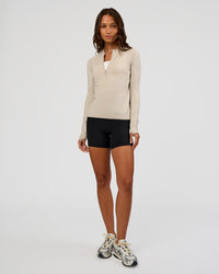 Woman wearing AeroFLX+ Long Sleeve Half Zip - Shale Beige/Shale Beige | Model:Dakota | Size:XS