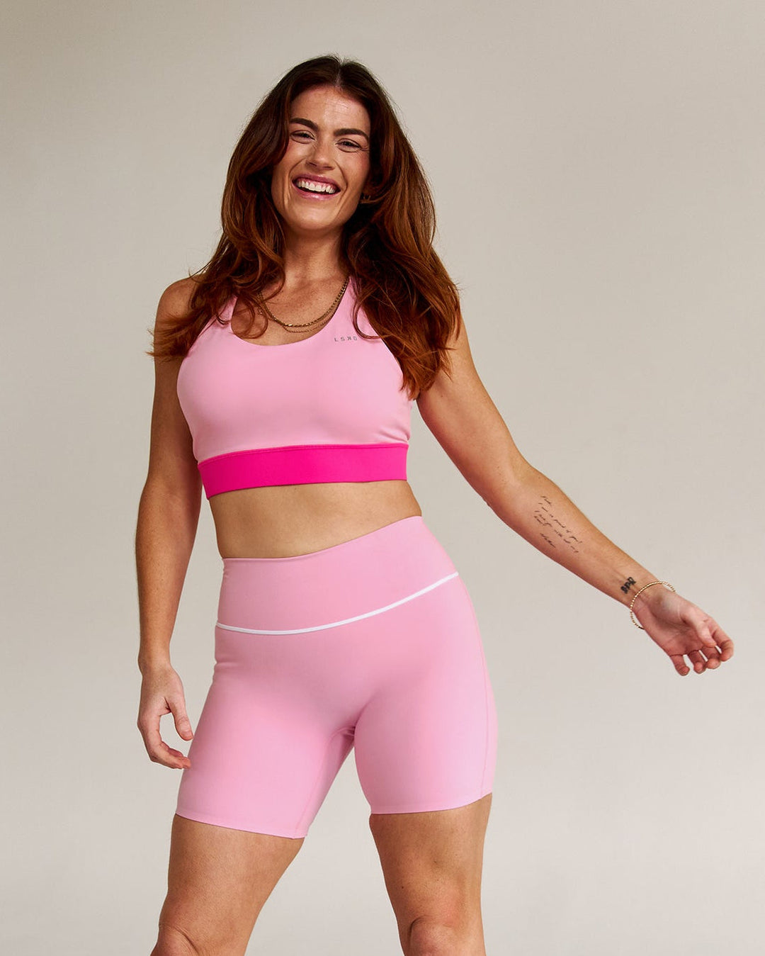 Campaign image of Accelerate Split Strap Sports Bra - Pink Rose-Ultra Pink - view 9