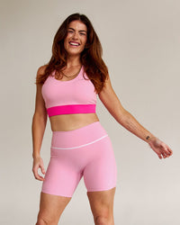 Campaign image of Accelerate Split Strap Sports Bra - Pink Rose-Ultra Pink | Thumbnail Index: 8