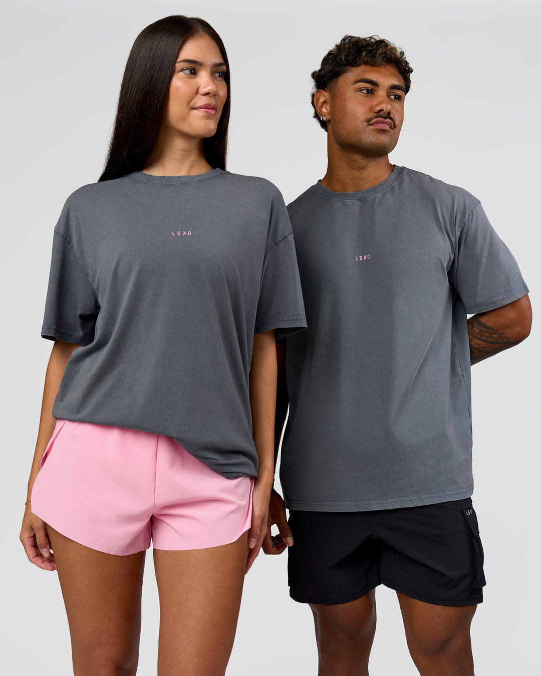 Duo wearing Built On Values FLXCotton Oversized Tee - Dark Storm Washed-Pink Rose | Model:Xav | Size:L | Model:Rhiley | Size:XS - view 6