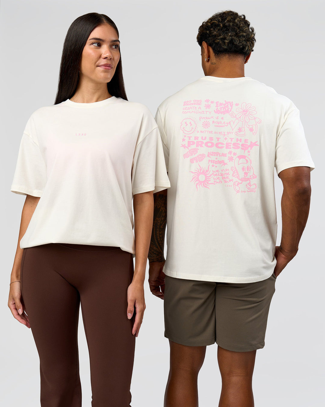 Duo wearing Built On Values FLXCotton Oversized Tee - Off White-Pink Rose | Model:Xav | Size:L | Model:Rhiley | Size:XS - view 1