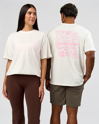 Duo wearing Built On Values FLXCotton Oversized Tee - Off White-Pink Rose | Model:Xav | Size:L | Model:Rhiley | Size:XS | Thumbnail Index: 0