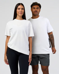 Duo wearing Clear Vision Heavyweight FLXCotton Oversized Tee - White-Black | Model:Xav | Size:L | Model:Rhiley | Size:XS | Thumbnail Index: 0