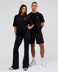Duo wearing Coffee Run FLXCotton Oversized Tee - Black-Ultra Orange | Model:Albert | Size:M | Model:Bianca | Size:XS | Thumbnail Index: 7