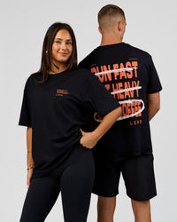 Duo wearing Coffee Run FLXCotton Oversized Tee - Black-Ultra Orange | Model:Albert | Size:M | Model:Bianca | Size:XS | Thumbnail Index: 0