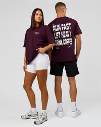 Duo wearing Coffee Run FLXCotton Oversized Tee - Cherry Lacquer-Black | Model:Albert | Size:M | Model:Bianca | Size:XS | Thumbnail Index: 1