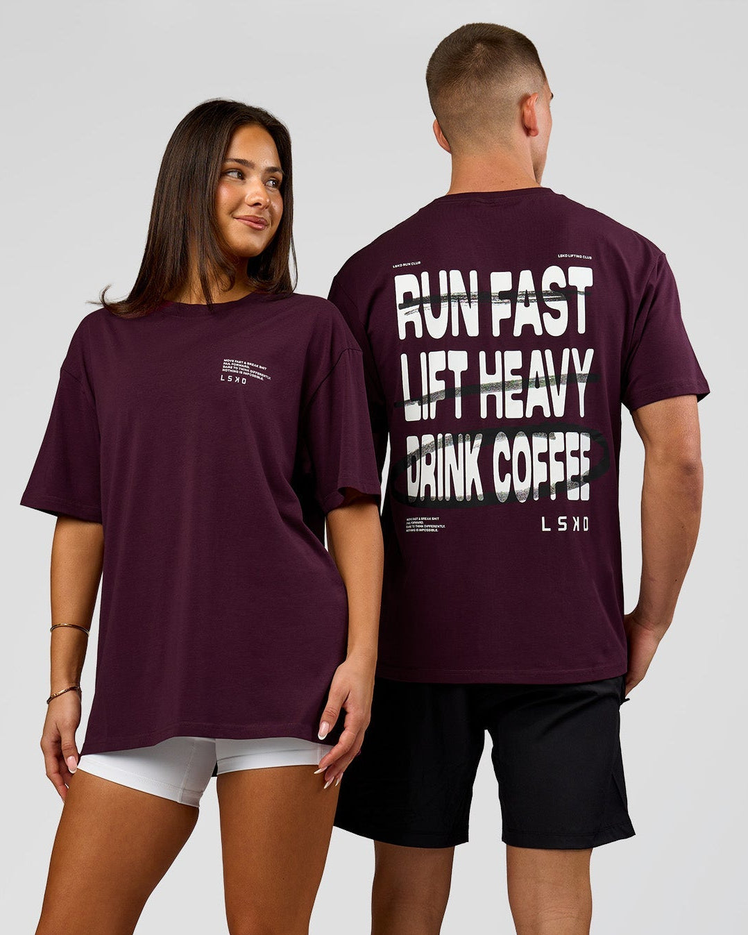Duo wearing Coffee Run FLXCotton Oversized Tee - Cherry Lacquer-Black | Model:Albert | Size:M | Model:Bianca | Size:XS
