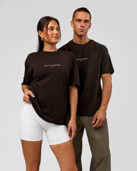 Duo wearing VS1 Enjoy The Journey FLXCotton Oversize Tee - Ground Coffee | Model:Albert | Size:M | Model:Bianca | Size:XS | Thumbnail Index: 0
