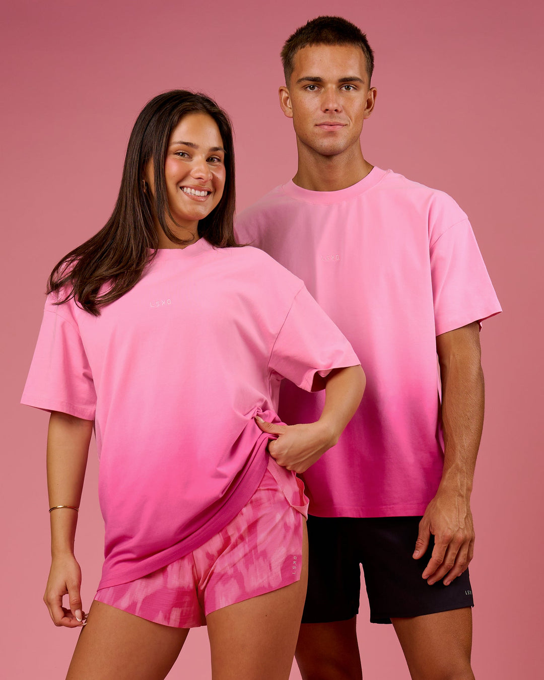 Duo wearing BCAM Ombre Heavyweight FLXCotton Oversized Tee  - Pink Rose-Ultra Pink | Model:Bianca | Size:S | Model:Albert | Size:M - view 10