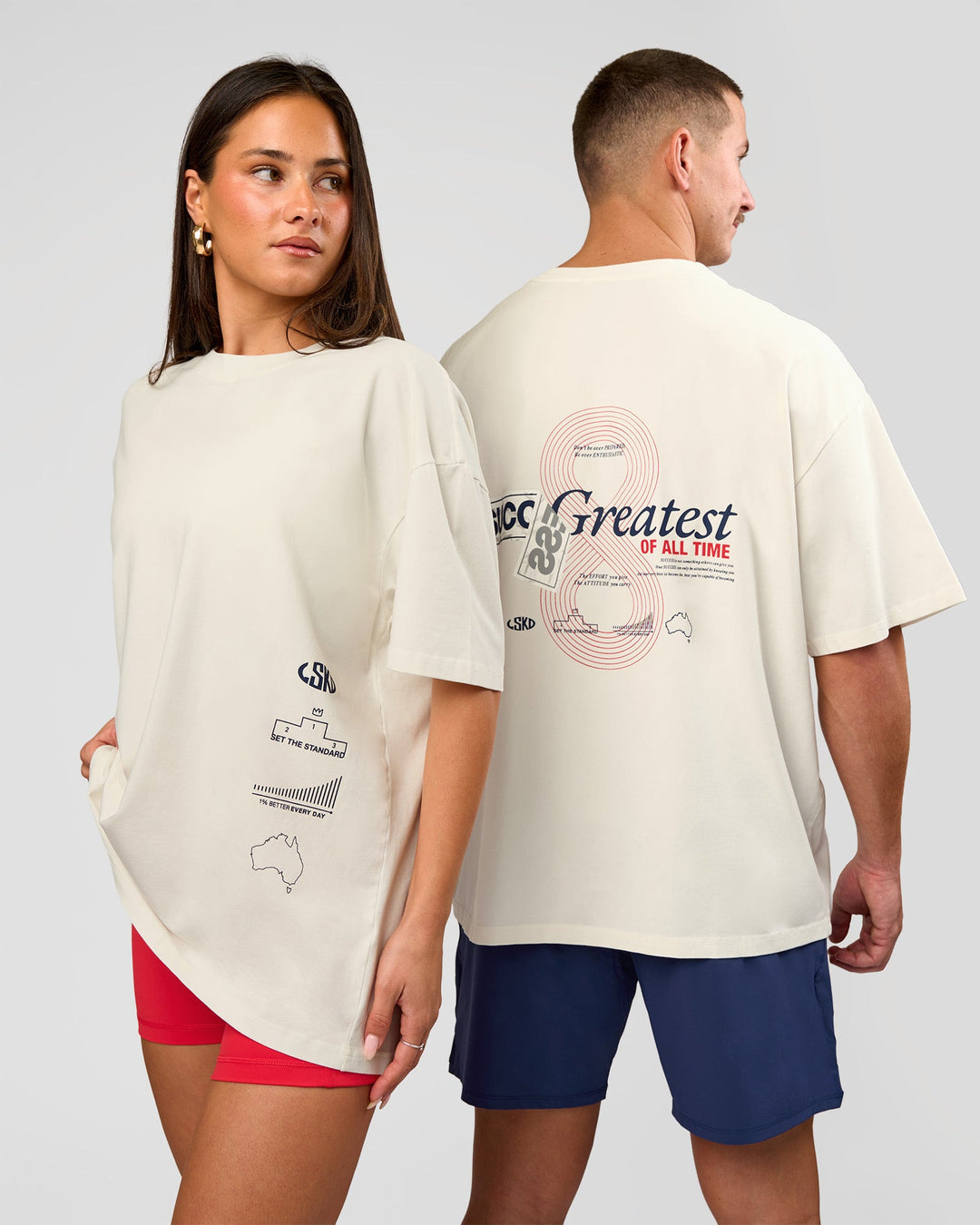 Duo wearing Greatest of All Time Heavyweight FLXCotton Oversized Tee - Off White Washed-Scarlet | Model:Bianca | Size:XS | Model:Jaiden | Size:L - view 2