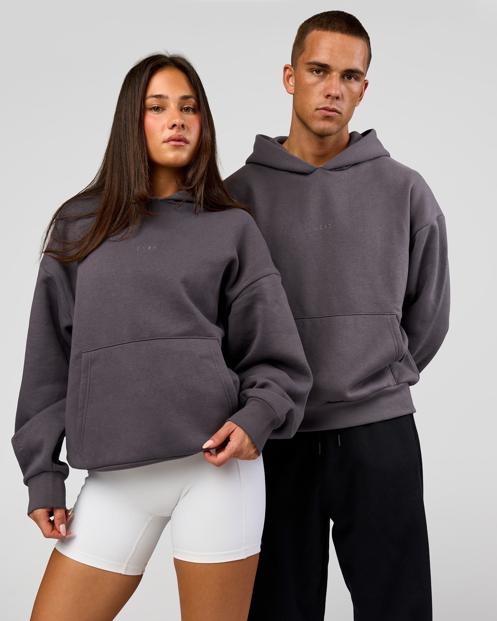 Duo wearing Base Oversized Hoodie - Duskstone | Model:Bianca | Size:XS | Model:Albert | Size:M