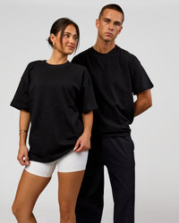 Duo wearing Tonal Legacy Heavyweight Oversized Tee - Black-Black | Model:Bianca | Size:XS | Model:Albert | Size:M | Thumbnail Index: 6