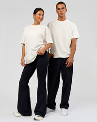 Duo wearing Tonal Legacy Heavyweight Oversized Tee - Off White-Off White | Model:Bianca | Size:XS | Model:Albert | Size:M | Thumbnail Index: 3