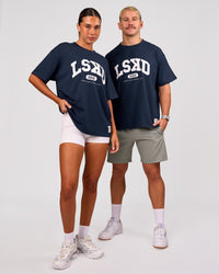 Duo wearing Varsity EST Heavyweight Oversized Tee  - Future Navy-White | Model:Charli | Size:XS | Model:Jaiden | Size:M | Thumbnail Index: 1