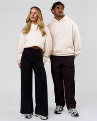 Duo wearing Tonal Legacy Boxy Hoodie - Off White-Off White | Model:Issy | Size:XS | Model:Xav | Size:L | Thumbnail Index: 6