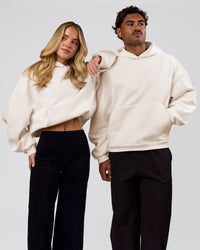 Duo wearing Tonal Legacy Boxy Hoodie - Off White-Off White | Model:Issy | Size:XS | Model:Xav | Size:L | Thumbnail Index: 9