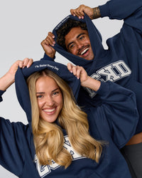 Duo wearing Varsity Boxy Hoodie - Future Navy-White | Model:Issy | Size:XS | Model:Xav | Size:L | Thumbnail Index: 11