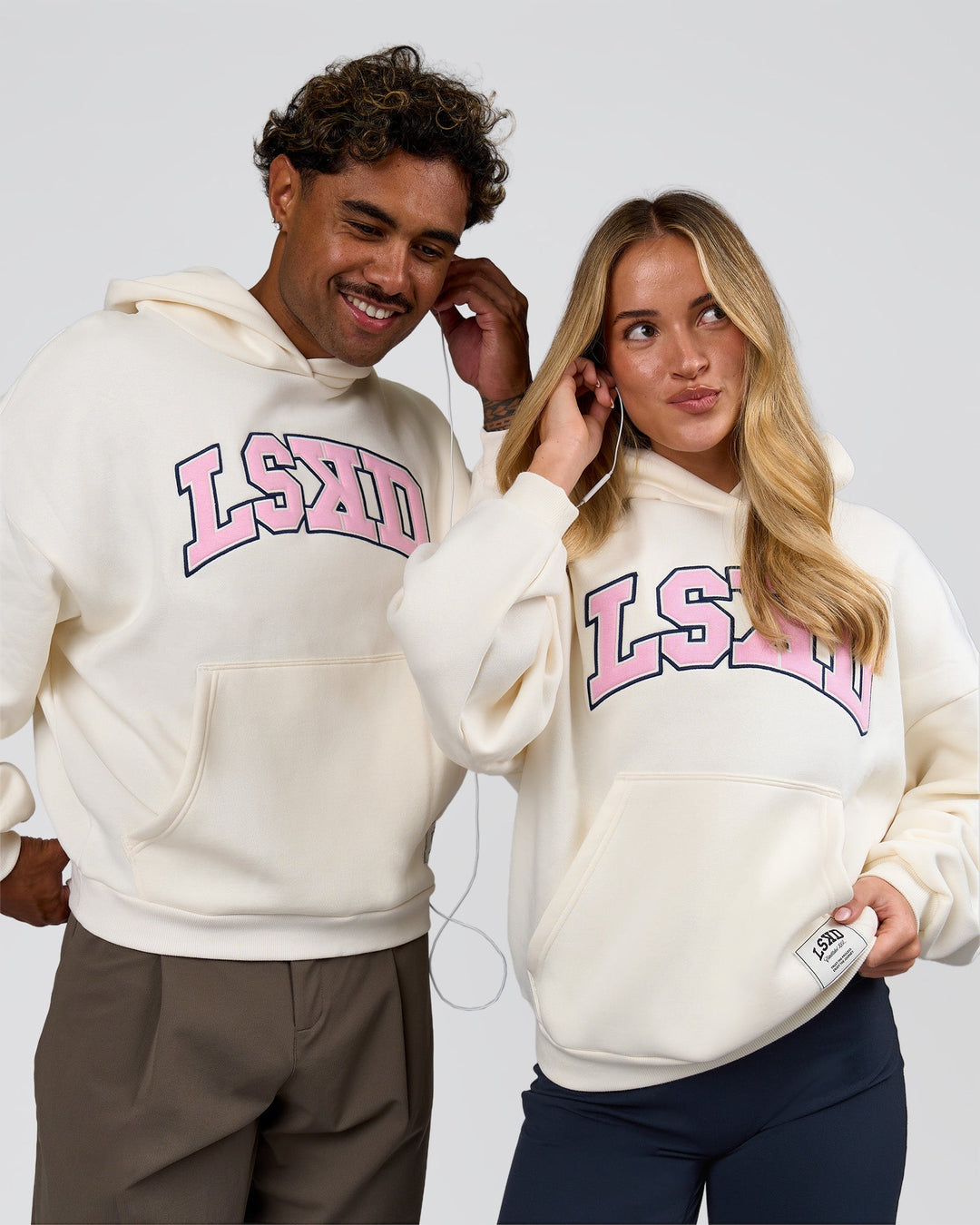 Duo wearing Varsity Boxy Hoodie - Off White-Pink Rose | Model:Issy | Size:XS | Model:Xav | Size:L - view 1